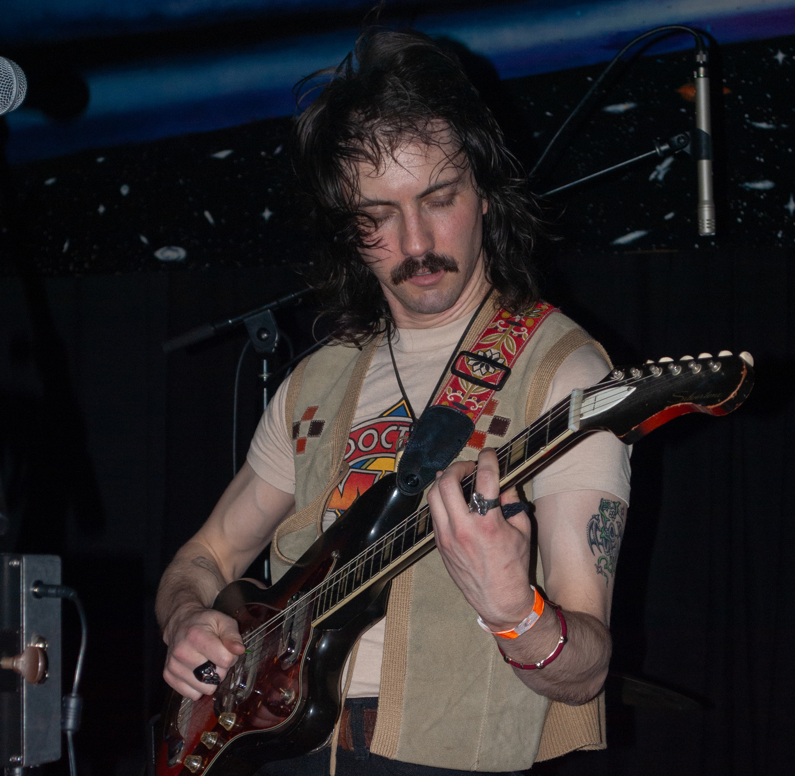 member playing guitar